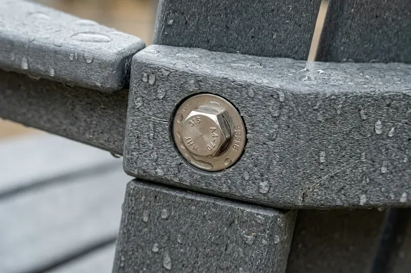 Polywood Adirondack chair marine-grade 316 stainless steel bolt joint assembly with rain droplets